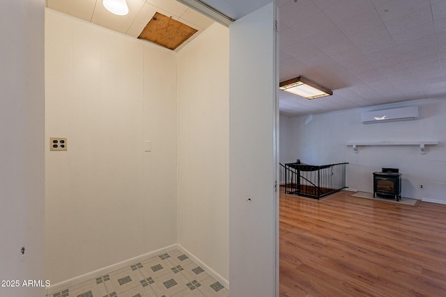 923 N Easy St, Payson, AZ 85541 - corridor featuring an AC wall unit, baseboards, and wood finished floors