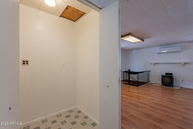 923 N Easy St, Payson, AZ 85541 - corridor featuring an AC wall unit, baseboards, and wood finished floors