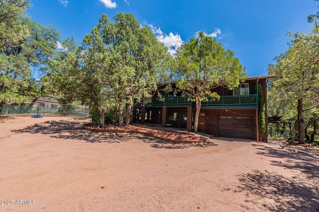 923 N Easy St, Payson, AZ 85541 - view of front of home with a garage, driveway, and fence