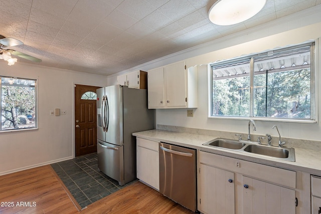 923 N Easy St, Payson, AZ 85541 - kitchen with a sink, light countertops, a ceiling fan, wood finished floors, and stainless steel appliances