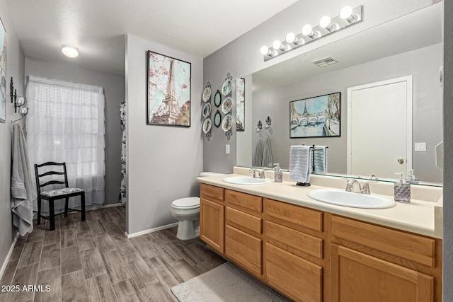 10566 E Bogart Ave, Mesa, AZ 85208 - bathroom with wood finished floors, double vanity, toilet, baseboards, and a shower with shower curtain