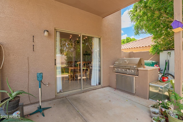 10566 E Bogart Ave, Mesa, AZ 85208 - view of patio / terrace featuring grilling area, fence, and exterior kitchen