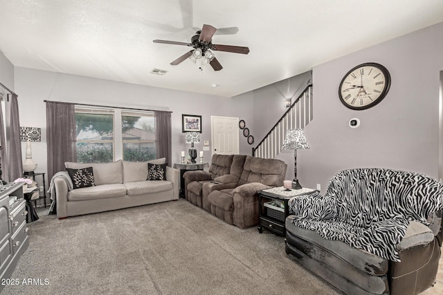 10566 E Bogart Ave, Mesa, AZ 85208 - living room featuring carpet floors, stairs, and a ceiling fan