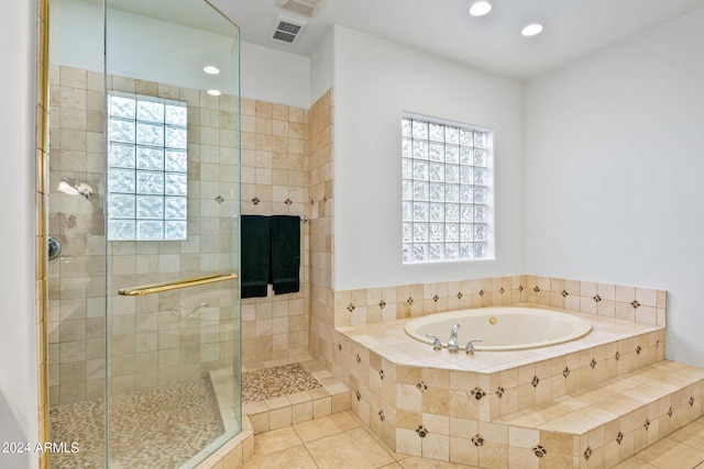 bathroom featuring independent shower and bath and tile patterned floors