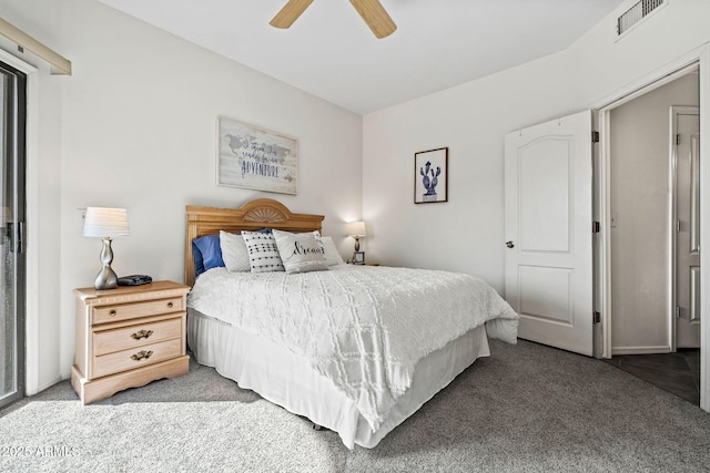 carpeted bedroom with a ceiling fan and visible vents