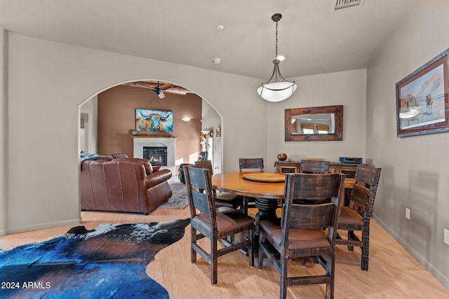 dining area featuring light hardwood / wood-style floors and ceiling fan