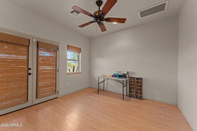 interior space featuring ceiling fan, light hardwood / wood-style floors, and french doors