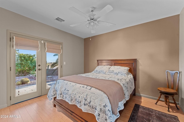 bedroom with access to outside, ceiling fan, french doors, and hardwood / wood-style flooring