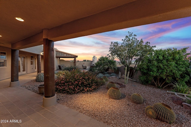 patio terrace at dusk with french doors