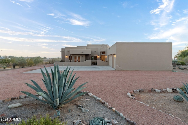 rear view of property featuring a patio area