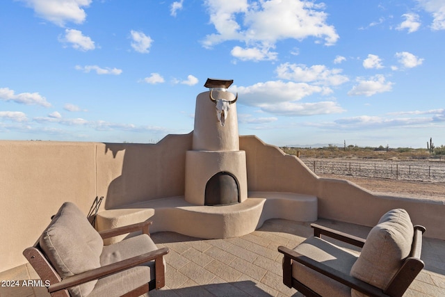 view of patio / terrace with exterior fireplace