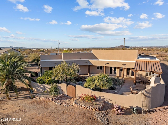 back of property featuring a patio