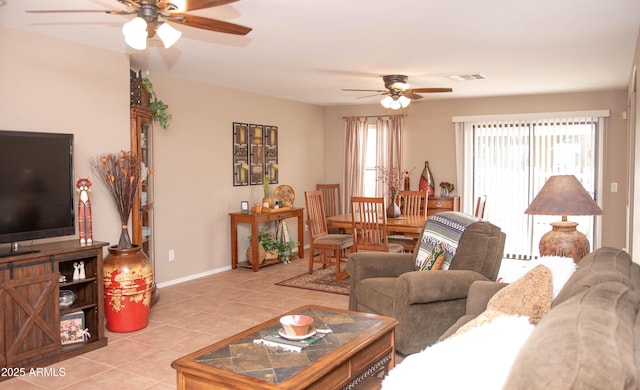 2101 S Meridian Rd Unit 176, Apache Junction, AZ 85120 - living area featuring a ceiling fan, light tile patterned floors, and baseboards