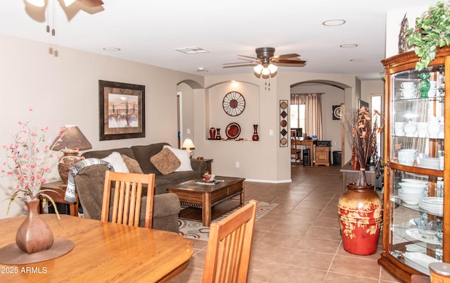 2101 S Meridian Rd Unit 176, Apache Junction, AZ 85120 - living area featuring arched walkways, a ceiling fan, light tile patterned floors, and baseboards