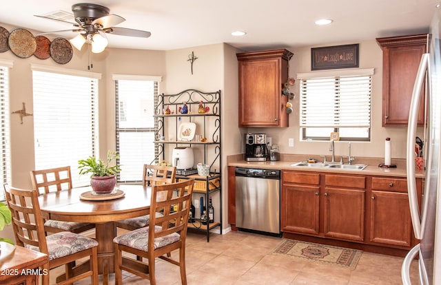 2101 S Meridian Rd Unit 176, Apache Junction, AZ 85120 - kitchen with stainless steel appliances, a sink, ceiling fan, light countertops, and brown cabinets
