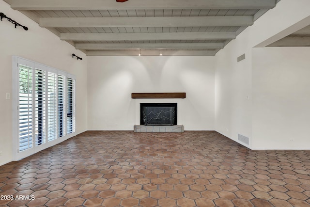 unfurnished living room featuring vaulted ceiling with beams and wood ceiling