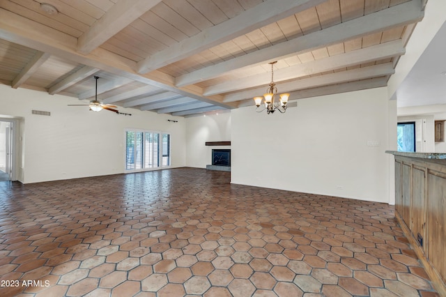 unfurnished living room with beamed ceiling, ceiling fan with notable chandelier, and wooden ceiling