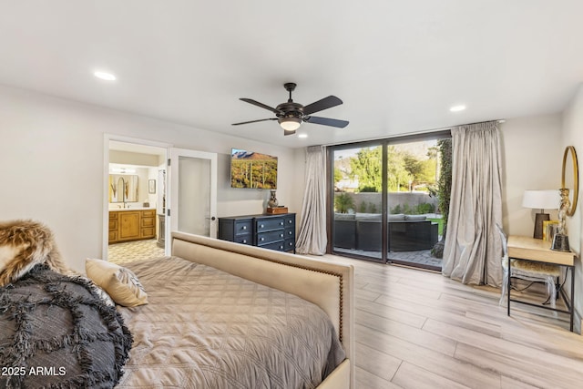 bedroom featuring ceiling fan, light wood-type flooring, ensuite bath, and access to outside