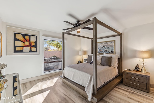 bedroom with ceiling fan and light wood-type flooring