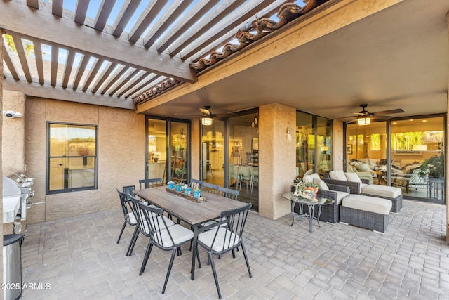 view of patio / terrace with area for grilling, a pergola, and ceiling fan