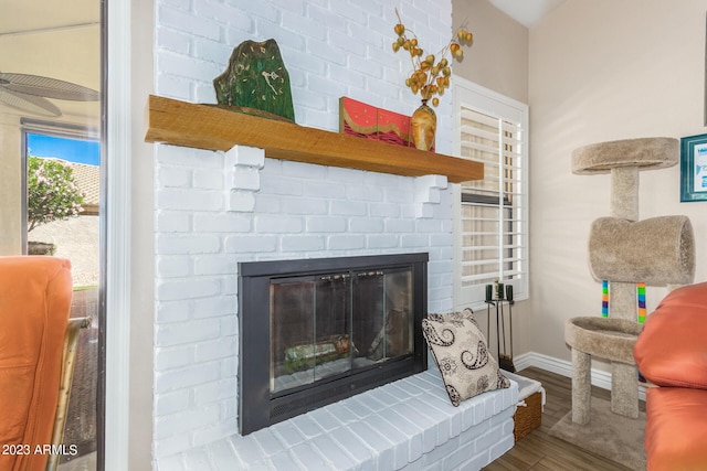 room details with hardwood / wood-style flooring and a fireplace