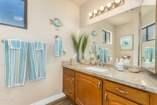 bathroom featuring vanity and wood-type flooring