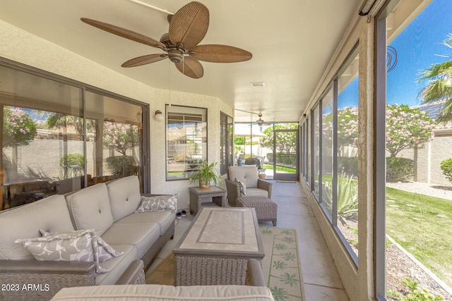 sunroom / solarium featuring ceiling fan