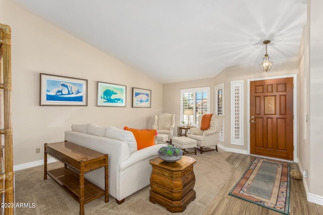 living room featuring lofted ceiling