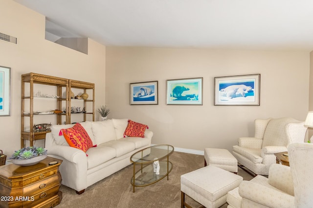 living room with vaulted ceiling and carpet