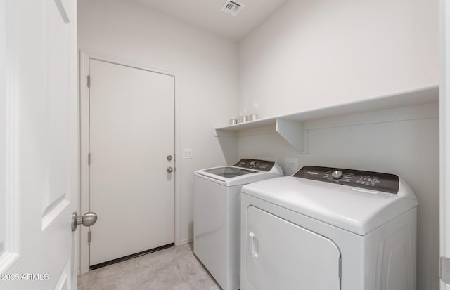 laundry room with washing machine and dryer