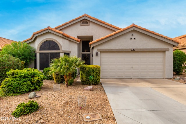 view of front of property featuring a garage