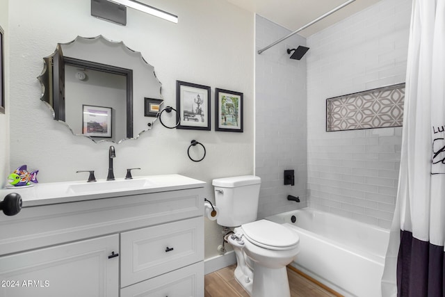 full bathroom with vanity, hardwood / wood-style flooring, toilet, and shower / tub combo with curtain