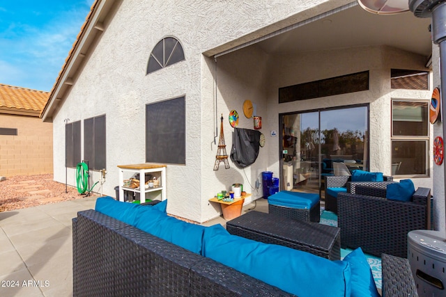 exterior space featuring an outdoor living space and a patio area