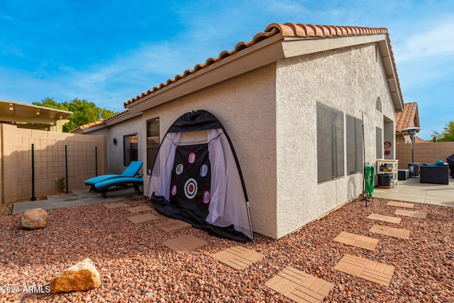 view of home's exterior with a patio