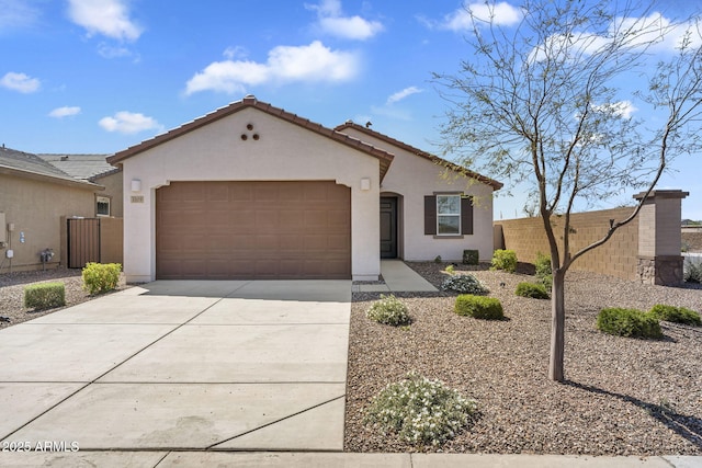 3309 E Malibu Dr, San Tan Valley, AZ 85143 - mediterranean / spanish home with a tiled roof, an attached garage, fence, concrete driveway, and stucco siding