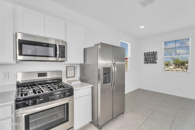 3309 E Malibu Dr, San Tan Valley, AZ 85143 - kitchen with white cabinetry, visible vents, light countertops, and appliances with stainless steel finishes