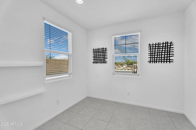 3309 E Malibu Dr, San Tan Valley, AZ 85143 - spare room featuring light tile patterned floors, baseboards, and a healthy amount of sunlight