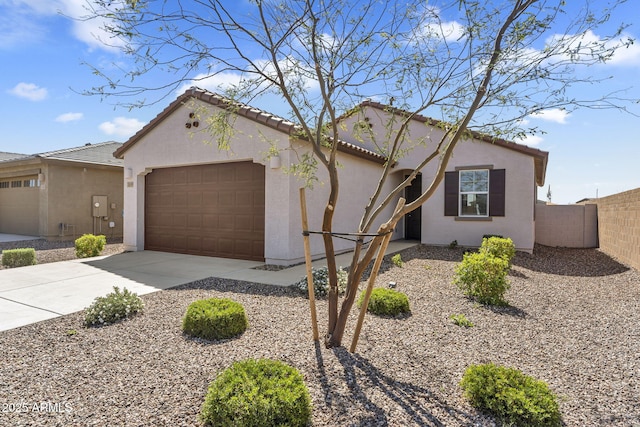 3309 E Malibu Dr, San Tan Valley, AZ 85143 - mediterranean / spanish-style home featuring driveway, stucco siding, fence, and an attached garage