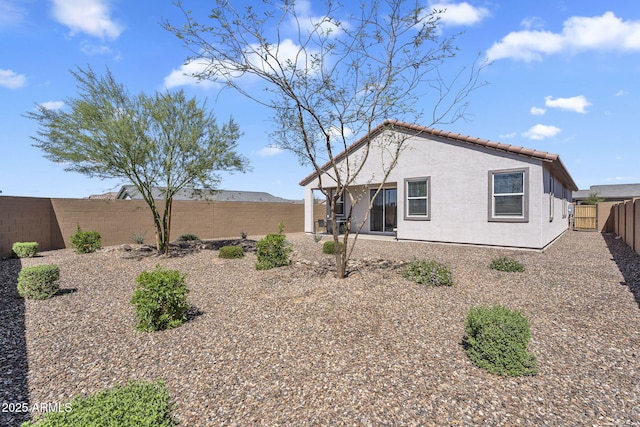 3309 E Malibu Dr, San Tan Valley, AZ 85143 - rear view of house featuring a patio, a fenced backyard, stucco siding, and a tile roof