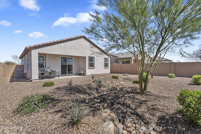3309 E Malibu Dr, San Tan Valley, AZ 85143 - back of house featuring a fenced backyard, stucco siding, a tile roof, and central AC
