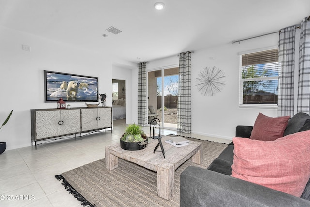 3309 E Malibu Dr, San Tan Valley, AZ 85143 - living area with baseboards, tile patterned flooring, visible vents, and a wealth of natural light