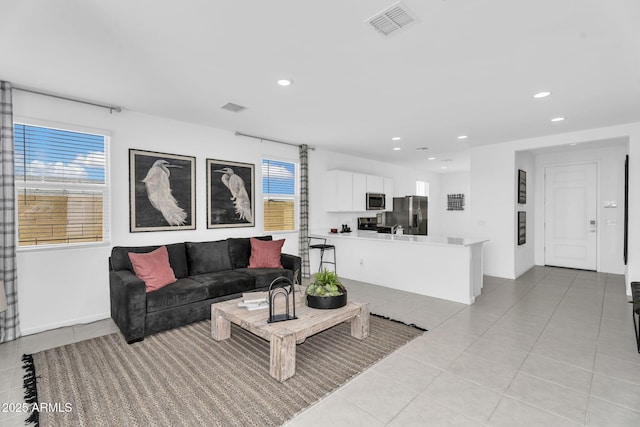 3309 E Malibu Dr, San Tan Valley, AZ 85143 - living area with light tile patterned flooring, baseboards, visible vents, and recessed lighting