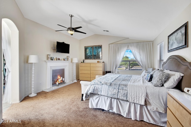 carpeted bedroom with lofted ceiling and ceiling fan