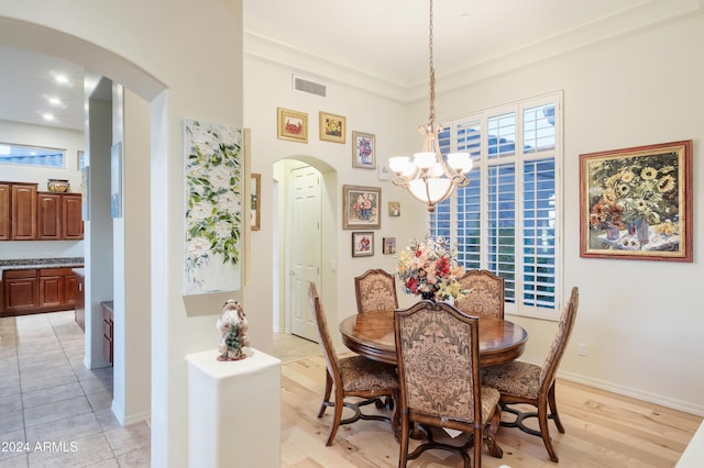 dining area featuring a notable chandelier