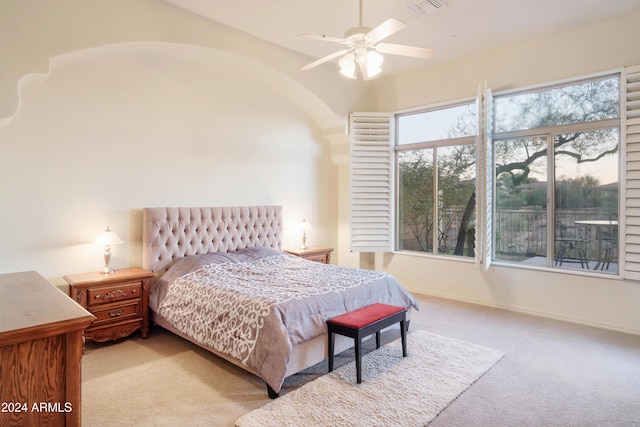 bedroom featuring ceiling fan and light carpet