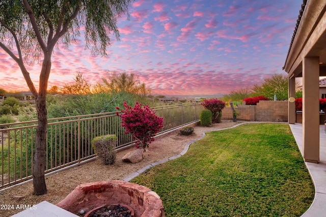 view of yard at dusk