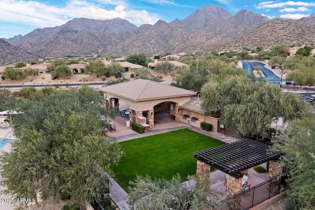 birds eye view of property featuring a mountain view