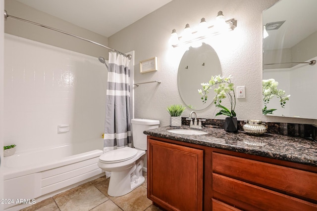 full bathroom featuring tile patterned floors, vanity, toilet, and shower / bath combo with shower curtain