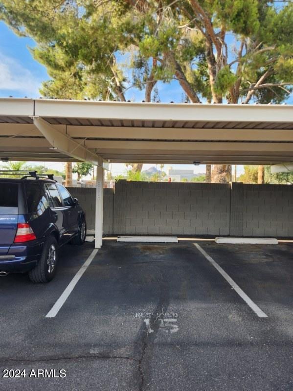 view of vehicle parking featuring a carport