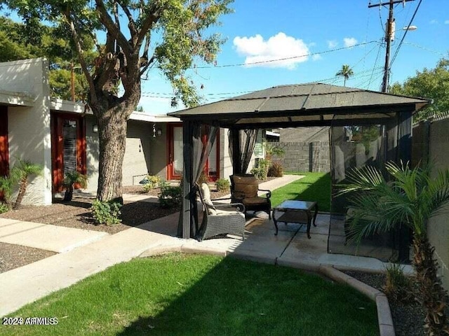 exterior space featuring a gazebo and an outdoor living space